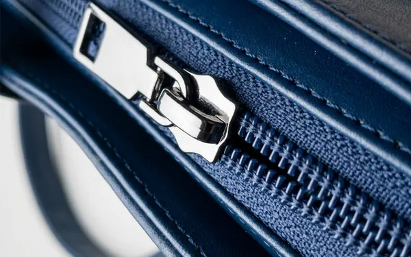 Navy Blue leather cross bag zipper close-up — quality YKK runner ladies handbag Bangladesh, women's sling bag finishing